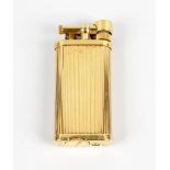 A Dunhill lighter, of oblong form having ribbed decoration, marked beneath 'Dunhill, Made in