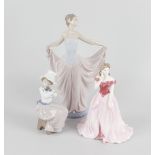 A group of five figures, comprising a Lladro figurine modelled as a young woman in flowing dress,