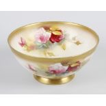 A Royal Worcester porcelain bowl, of circular form, decorated with roses by E Spilsbury, with