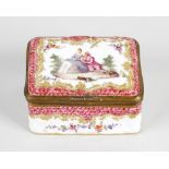 A German ceramic box, of rectangular form, having design of couple surrounded by pink scallop and