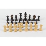 A 19th century boxwood chess set, comprising natural and ebonised pieces each of turned form,