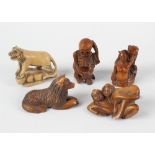 A selection of six various Japanese carved wooden netsukes, comprising natural and stained