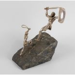 Judaica: An Israeli ornament, modelled as David and Goliath upon a sloping rock base, 9 (23cm) high.