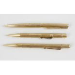 Three 9ct gold mechanical pencils. Comprising a Sampson Mordan & Co. example, a Parker, plus