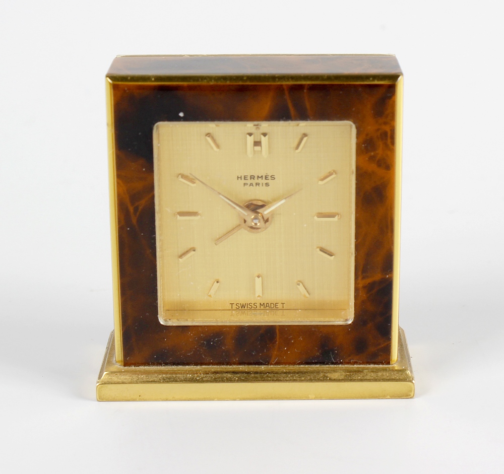 A gilt and simulated tortoiseshell back wound time piece movement with alarm, the gilt dial with