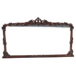 A Victorian carved mahogany overmantel mirror, previously a sideboard mirror back, the arched