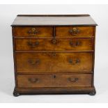 An 18th century walnut chest of drawers. The rectangular top having banded inlay above two short