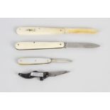 A mother of pearl handled fruit knife with hallmarked Sheffield 1923 folding silver blade, three