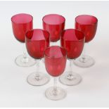 A box containing a mixed selection of cranberry glass, to include various drinking glasses, a