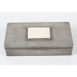 A French Art Deco 800 continental silver rectangular box and cover, the hinged opening cover inset
