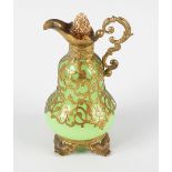 A green glass scent bottle, formed as a ewer of Palais Royale style, having pear form body, the