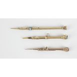 Two retractable pencils, the first having engine turned textured body, turquoise cabochon detail and