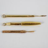 An 18ct gold retractable pencil of plain ovoid form, plus a toothpick within plain cylindrical outer