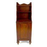 A small 19th century mahogany chiffonier, having two graduated shelves over the single cupboard with