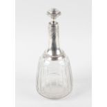 A late 19th century white metal mounted and clear cut glass decanter and stopper of mallet form, the