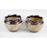 A pair of Doulton Lambeth Slater's Patent stoneware jardinières, each with dark blue ground,