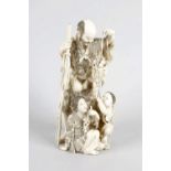 A Japanese Meiji period ivory figure group, modelled as an elder offering two youths a basket of