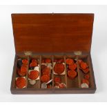 A selection of various wax seals, of red and black wax with armorials, crests, etc., within a