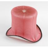 An unusual frigger glass top hat, circa 1900, of pink and opaque glass with 'Nailsea' style