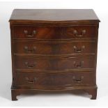 A group of reproduction chest of drawers, to include a serpentine front mahogany example, a set of