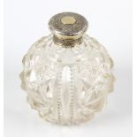 A mid Victorian silver-gilt mounted cut glass scent bottle, of globular form having foliate