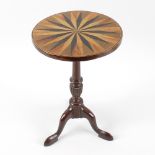 A good 19th century inlaid apprentice table, the circular top having alternate natural and