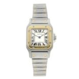 CARTIER - a Santos bracelet watch. Stainless steel case with yellow metal bezel. Reference 1567,