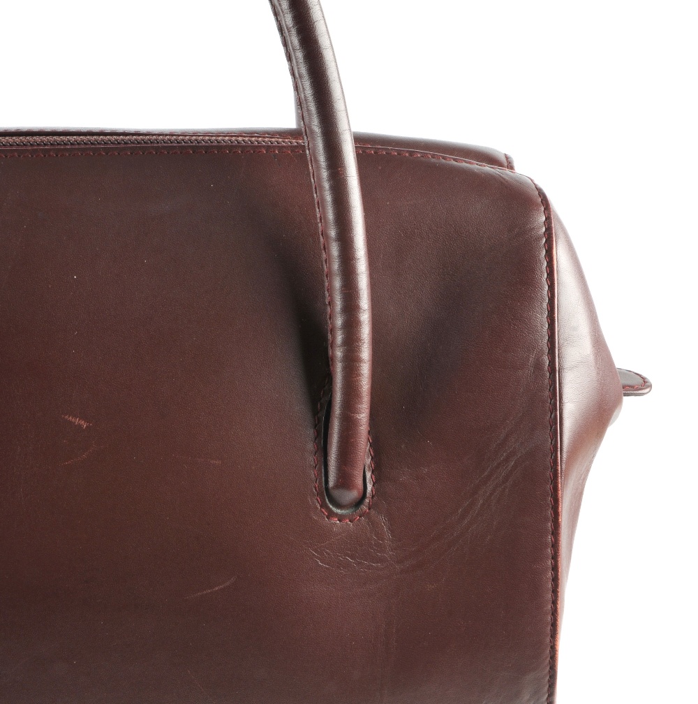 CARTIER - a Bordeaux Boston handbag. Featuring double thin looping handles, top zip fastening, - Image 2 of 5