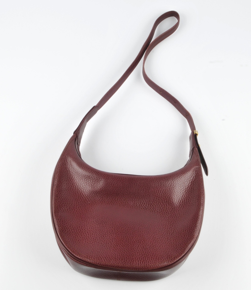 CARTIER - a Bordeaux leather hobo handbag. Featuring a burgundy textured leather exterior with a - Image 2 of 5