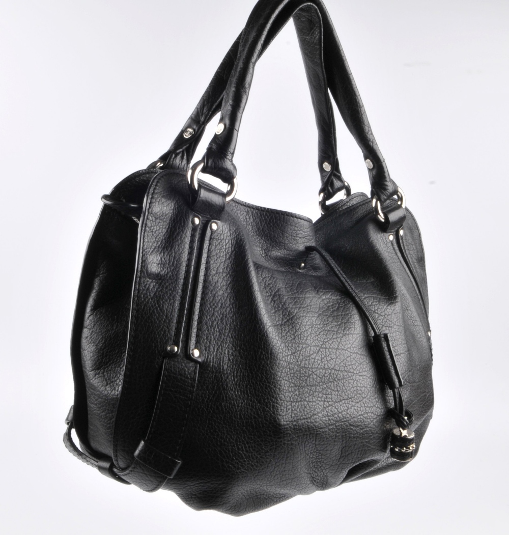 CELINE - a black leather Bittersweet hobo bag. Designed with a soft pebbled leather exterior, - Image 2 of 6