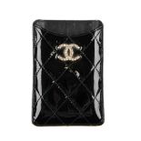 CHANEL - a quilted patent leather phone case. Designed with maker's classic diamond quilted black