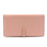 CHANEL - a pink leather wallet. The bifold wallet with press-stud fastening and pink enamel button