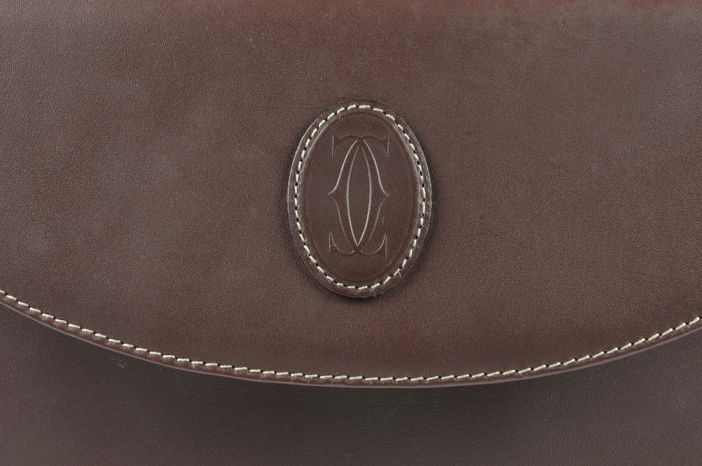 CARTIER - a Bordeaux leather handbag. Designed with maker's classic burgundy leather exterior and - Image 2 of 5
