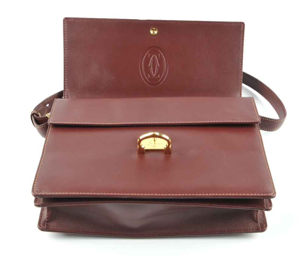 CARTIER - a Bordeaux leather satchel. Crafted from maker's classic burgundy leather, featuring - Image 3 of 5