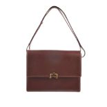 CARTIER - a Bordeaux leather handbag. Featuring a burgundy leather exterior, adjustable leather