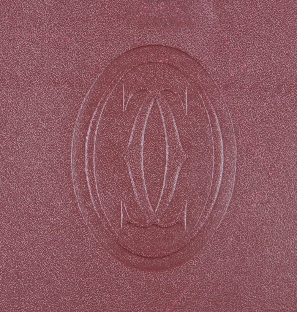 CARTIER - a Bordeaux leather handbag. Featuring maker's signature burgundy leather exterior, - Image 7 of 7