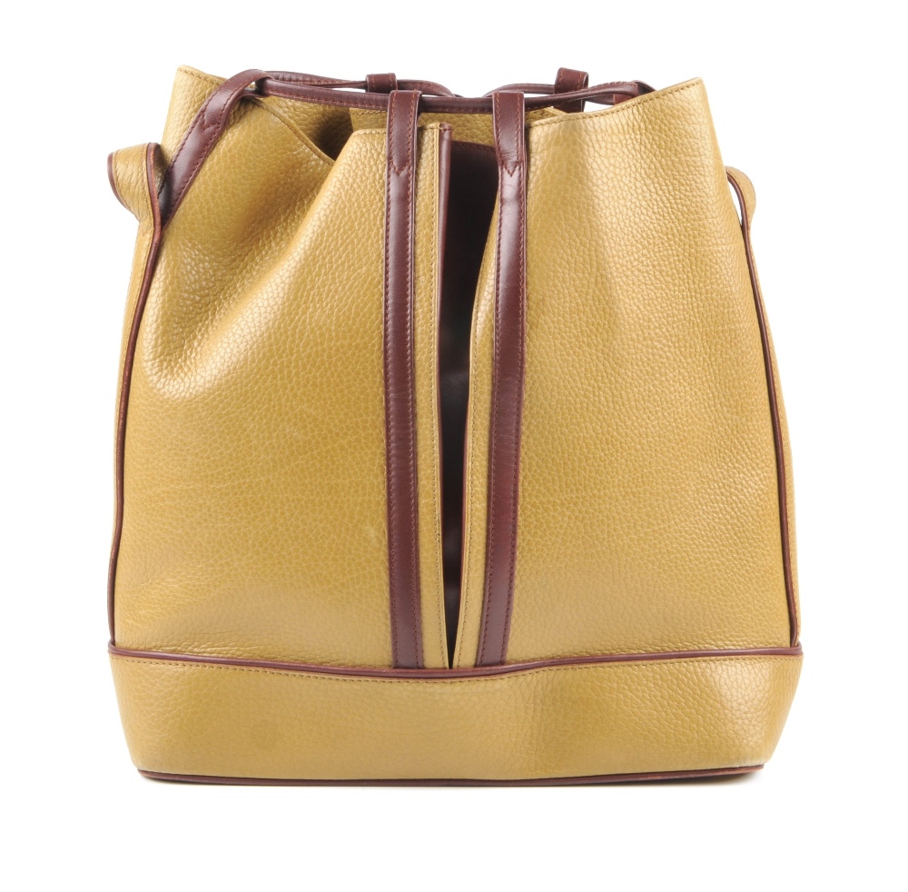 CARTIER - a two-tone bucket tote handbag. Designed with a pebbled mustard leather exterior and - Image 5 of 7