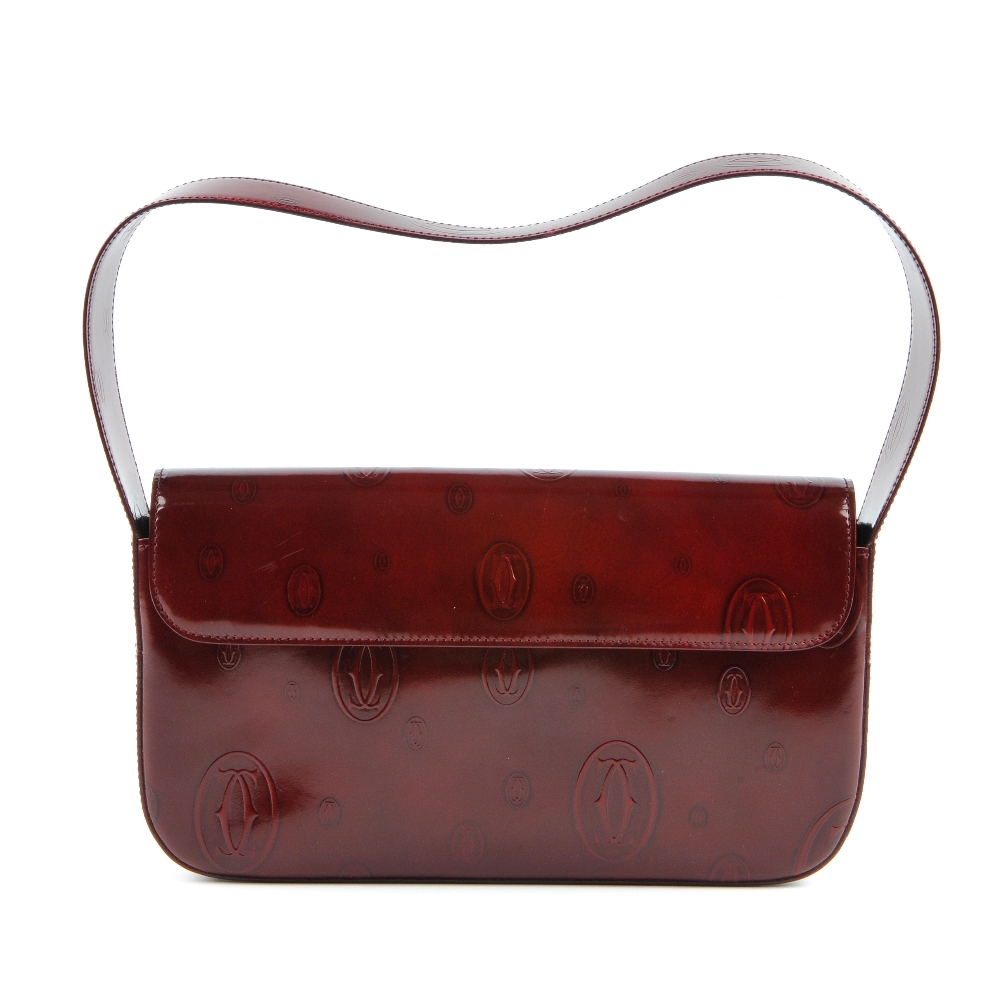 CARTIER - a Happy Birthday Bordeaux baguette handbag. Designed with a structured shape, featuring