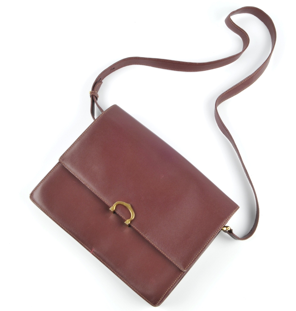CARTIER - a Bordeaux leather handbag. Featuring maker's signature burgundy leather exterior, - Image 3 of 7