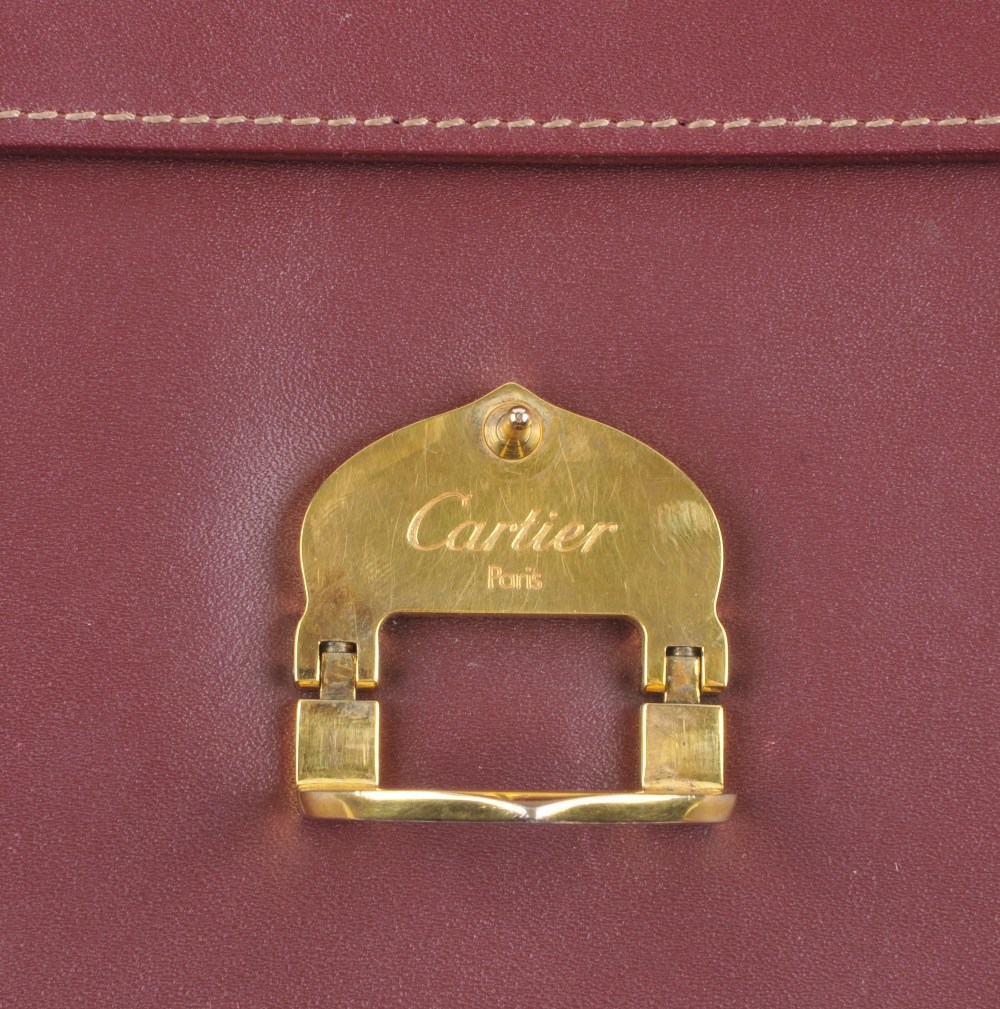 CARTIER - a Bordeaux leather handbag. Featuring maker's signature burgundy leather exterior, - Image 5 of 7