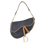 CHRISTIAN DIOR - a blue denim saddle handbag. Featuring a blue denim canvas exterior, smooth beige
