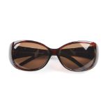 FENDI - a pair of Zucca sunglasses. Featuring dark havana brown acetate frames, brown tinted