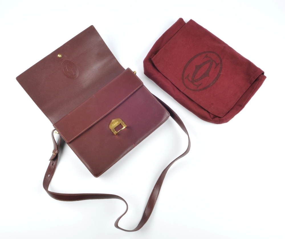 CARTIER - a Bordeaux leather handbag. Featuring maker's signature burgundy leather exterior, - Image 6 of 7