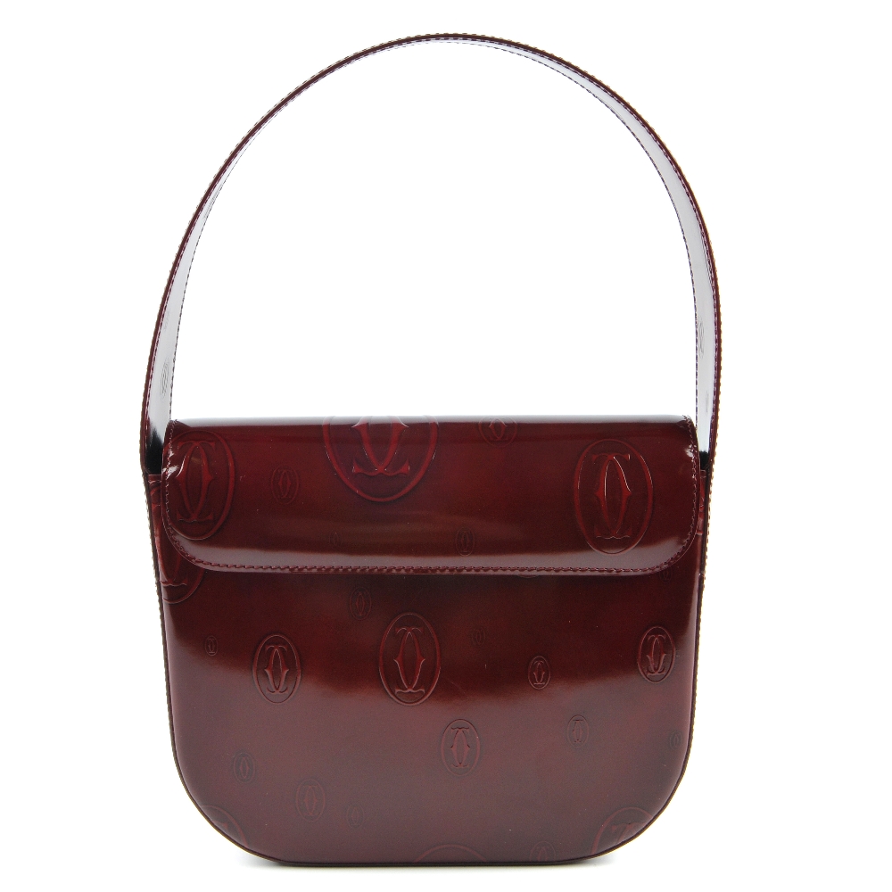CARTIER - a Happy Birthday Bordeaux handbag. Designed with a structured shape, burgundy monogram