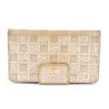 CHANEL - a gold embossed wallet. Of gold leather with checkerboard pattern embossed to many of the