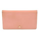 CHANEL - a pink bi-fold wallet. The grained pink leather exterior with enamel button with 'CC'