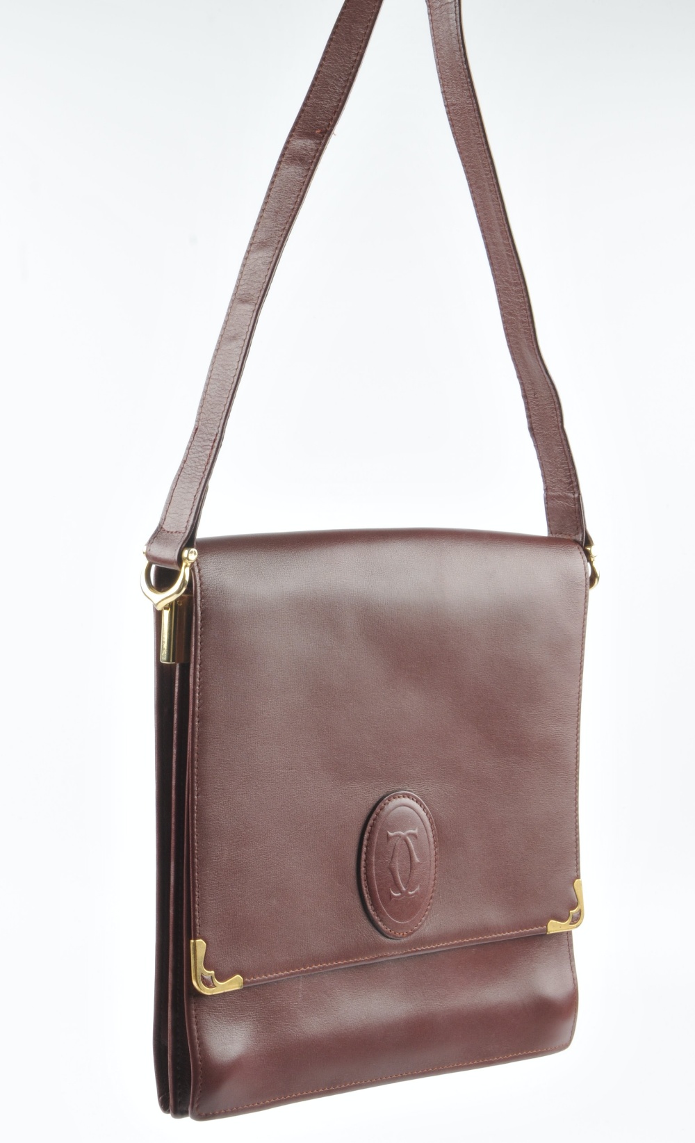 CARTIER - a Bordeaux leather handbag. Featuring a top flap closure with maker's embossed logo emblem - Image 3 of 5