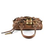 CHLOE - a mini Paddington handbag. Featuring a grained brown calfskin leather exterior, dual