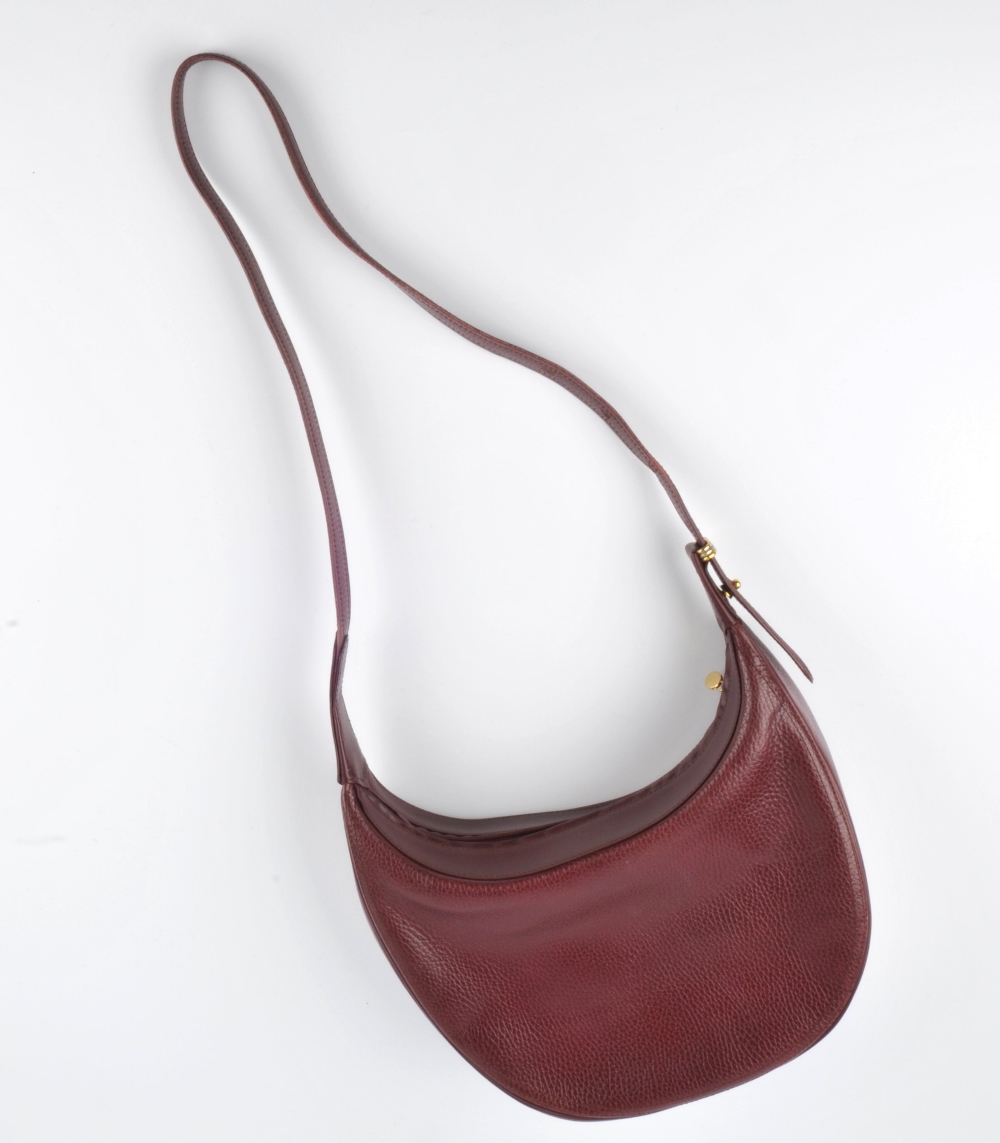 CARTIER - a Bordeaux leather hobo handbag. Featuring a burgundy textured leather exterior with a - Image 5 of 5