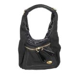 CHLOE - a black leather hobo handbag. Designed with a matte black leather exterior and patent